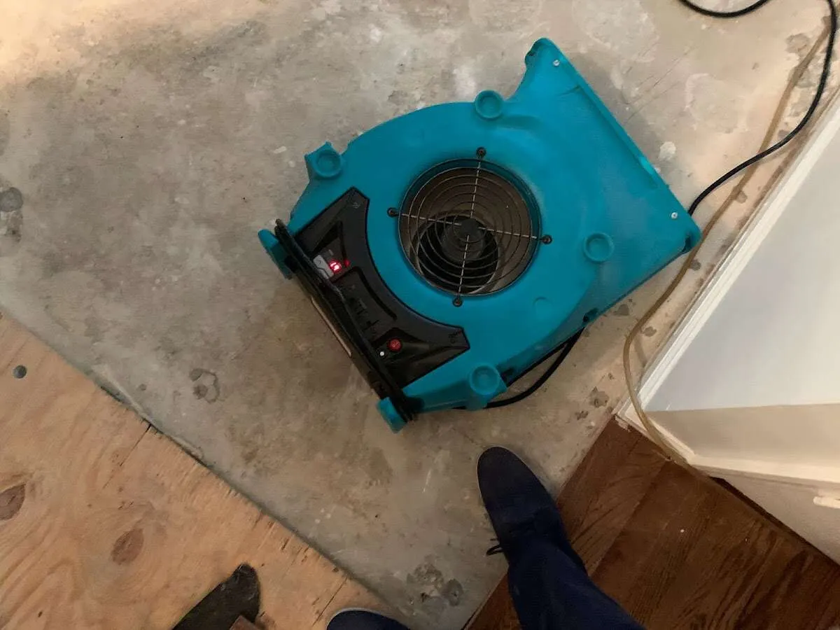 Air mover drying subfloor during Commercial Water Damage Restoration in Harwood Heights